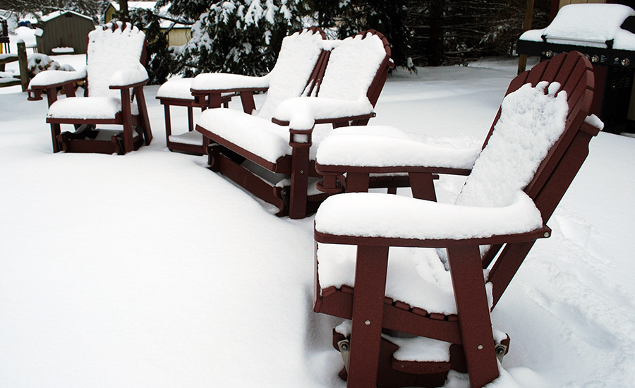 poly furniture covered with snow